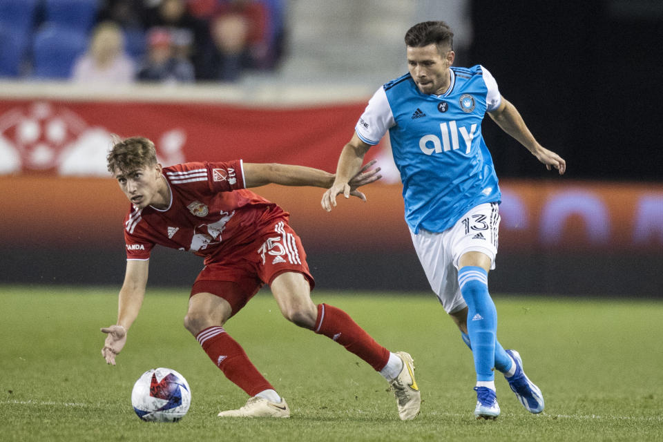 New York Red Bulls midfielder Daniel Edelman, left, is defended by Charlotte FC midfielder Brandt Bronico during the first half of an MLS soccer match Wednesday, Oct. 25, 2023, in Harrison, N.J. (AP Photo/Eduardo Munoz Alvarez)