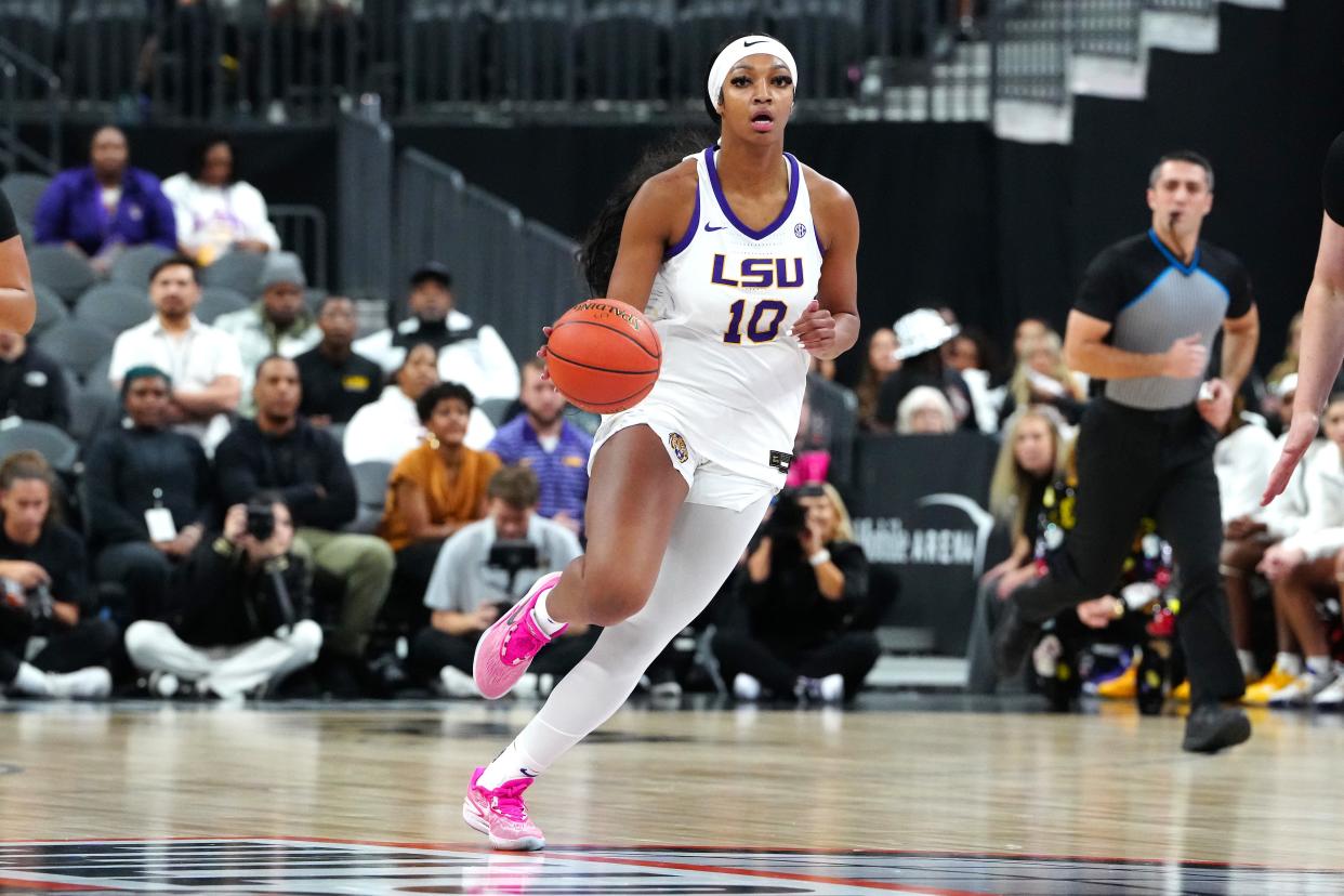 LSU forward Angel Reese dribbles against Colorado during a game Nov. 6.