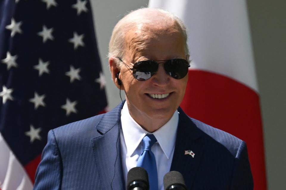 President Joe Biden smiles during a joint press conference with Japanese Prime Minister Fumio Kishida (out of frame) in the Rose Garden of the White House in Washington, DC, April 10, 2024.