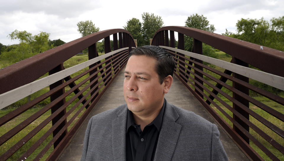 Jose Sagaseta poses for a photograph near his home in Fulshear, Texas, Monday, May 4, 2020. Sagaseta thought his job of eight years with an oilfield services company in Houston was safe. He was laid off in mid-April. Like in other cities, the coronavirus has shut down much of Houston's economic activity, slashing thousands of jobs, while at the same time, the price of oil plunged below zero recently as demand plummeted due to the worldwide lockdown to stop the spread of the virus. (AP Photo/David J. Phillip)