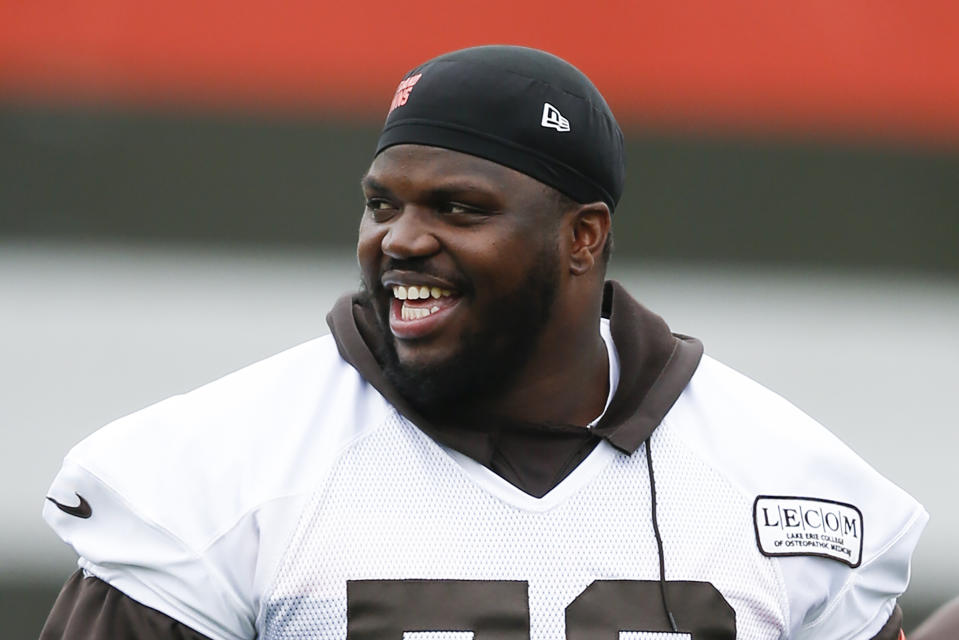 FILE - In this May 22, 2019, file photo, Cleveland Browns' Greg Robinson walks off the field during an NFL football organized team activity session at the team's training facility in Berea, Ohio. Browns starting left tackle Greg Robinson has re-signed with the team Monday, Sept. 2, 2019, a day after his contract was surprisingly terminated. (AP Photo/Ron Schwane, File)