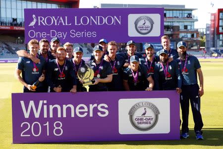 Cricket - England v Australia - Fifth One Day International - Emirates Old Trafford, Manchester, Britain - June 24, 2018 England's Eoin Morgan celebrates with the trophy and team mates after winning the series Action Images via Reuters/Craig Brough