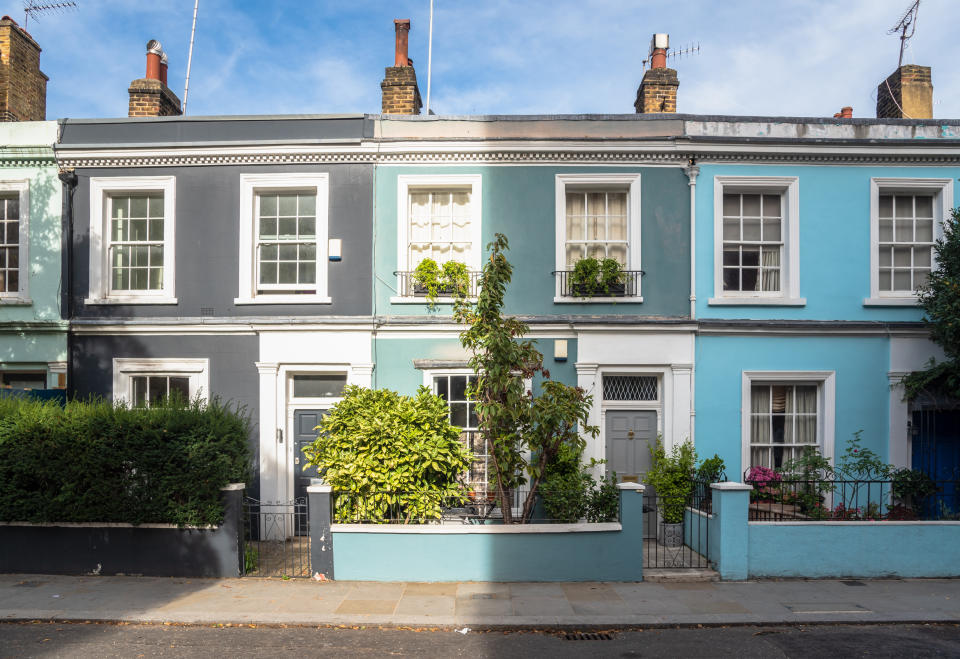 Row of Colourful Old Terraced Houses in the London Neighbourhood of Notting Hill on a Sunny Autumn Day