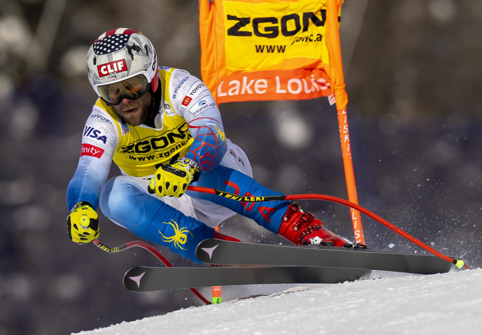 FILE - Travis Ganong of the Unites States skis down the course during the men's World Cup downhill ski training run in Lake Louise, Alberta, Tuesday Nov. 23, 2021. Ganong announced Thursday, March 2, 2023, his journey on ski racing’s World Cup carousel ends after the season. (Frank Gunn/The Canadian Press via AP, File)