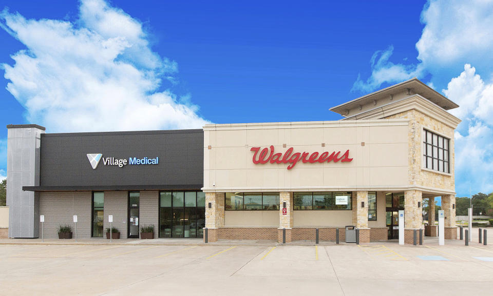 This June 2020 photo provided by VillageMD shows a Walgreens with an adjoining VillageMD in Houston. Walgreens will squeeze the primary care clinics into as many as 700 of its U.S. stores over the next few years in a major expansion of the care it offers customers. The drugstore chain said Wednesday, July 8 that it will partner with VillageMD to set up doctor-led clinics that also use nurses, social workers and therapists to provide regular treatment for patients. (VillageMD via AP)