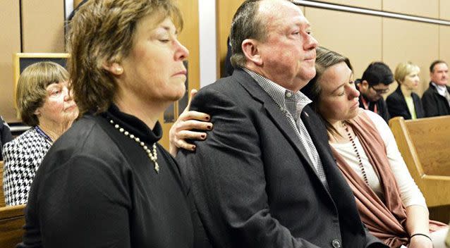 Michelle Wilkins, right, hugs her father as a verdict is read in Dynel Lane's trial. Source: AP.