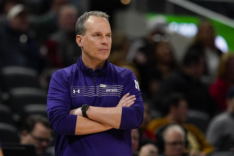 Northwestern head coach Chris Collings watches during the second half of an NCAA college basketball game against Iowa at the Big Ten Conference tournament in Indianapolis, Thursday, March 10, 2022. Iowa defeated Northwestern 112-76. (AP Photo/Michael Conroy)