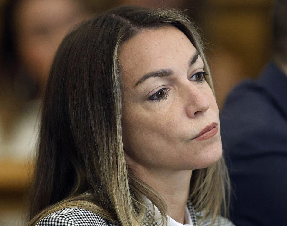 Defendant Karen Read looks at witness Jen McCabe as she McCabe takes the witness stand to testify during Read's murder trail, Wednesday, May 22, 2024,, at Dedham Superior Court in Dedham, Mass. Read is facing charges including second degree murder in the 2022 death of her boyfriend Boston Officer John O’Keefe. (Greg Derr/The Patriot Ledger via AP, Pool)