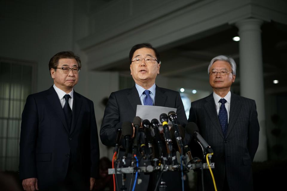 South Korean National Security Advisor Chung Eui-yong flanked by South Korea National Intelligence Service chief Suh Hoon (L) and South Korea's ambassador to the United States Cho Yoon-je (R), outside the West Wing of the White House on March 8, 2018 in Washington, DC.