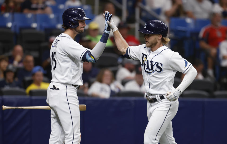 Tampa Bay Rays' Taylor Wells, right, celebrates with Josh Lowe after hitting a home run against the Boston Red Sox during the fourth inning of a baseball game Wednesday, July 13, 2022, in St. Petersburg, Fla. (AP Photo/Scott Audette)