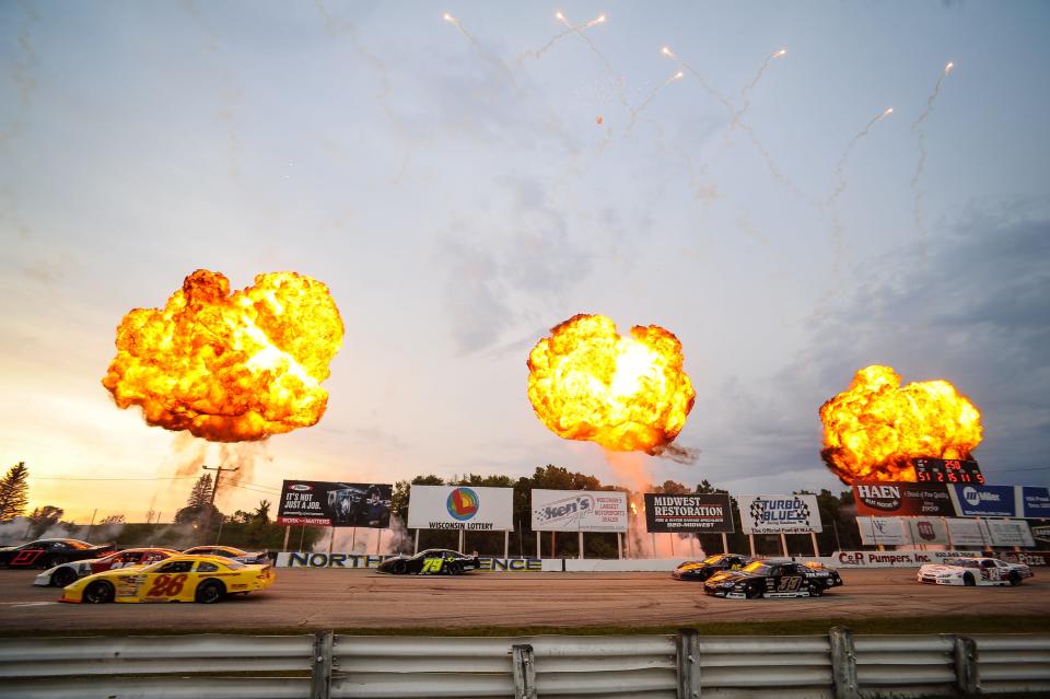 Pyrotechnics greet drivers on the back stretch on a parade lap before the Gandrud Auto Group 250 last year.