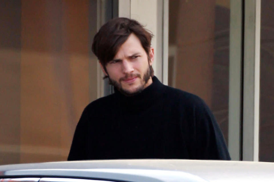 Ashton Kutcher looks the spitting image of a young Steve Jobs as he grabs a coffee near his home before heading to a film studio.