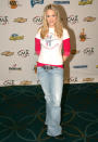 Fresh off that “Idol” win, Underwood kept it casual in distressed jeans, an embellished belt, a T-shirt, and boots at the country music event in NYC. Unfortunately, this wasn’t her best look … but she was just starting to find her fashion footing. (11/13/2005)