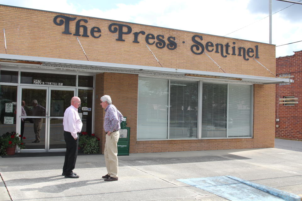 W.H. "Dink" NeSmith (right) talks to a Wayne County resident outside the offices of the Press-Sentinel, a newspaper he has owned for more than 30 years.&nbsp; (Photo: Georgina Gustin/InsideClimate News)