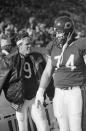 FILE - In this Jan. 5, 1986, file photo, Chicago Bears' quarterback Jim McMahon, left, sticks out his tongue as he and Jim Covert stand on the sidelines during an NFL football game against the New York Giants in Chicago. Covert made the people he played alongside look good, and after a nearly two-decades-long wait, the tough Chicago Bears left tackle will join them in the Pro Football Hall of Fame. (AP Photo, File)