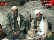 Osama bin Laden, left, with his top lieutenant Egyptian Ayman al-Zawahri, is seen at an undisclosed location in this television image broadcast Sunday, Oct. 7, 2001. Bin Laden praised God for the Sept. 11 terrorist attacks and swore America "will never dream of security until the infidel's armies leave the land of Muhammad" in a videotaped statement aired after the strike launched Sunday by the United States and Britain in Afghanistan. (AP Photo/Al Jazeera)
