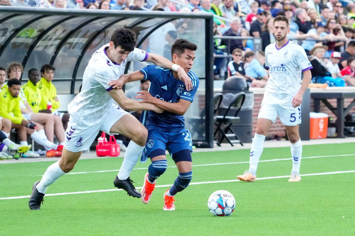 Union Omaha midfielder Pedro Dolabella, left, challenges Sporting Kansas City midfielder Felipe Hernández for possession during Wednesday evening’s Lamar Hunt U.S. Open Cup match at Caniglia Field in Omaha, Nebraska. Dylan Widger/USA TODAY Sports