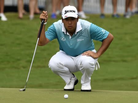 Aug 11, 2017; Charlotte, NC, USA; Hideki Matsuyama lines up his putt on the 10th green during the second round of the 2017 PGA Championship at Quail Hollow Club. Mandatory Credit: Michael Madrid-USA TODAY Sports