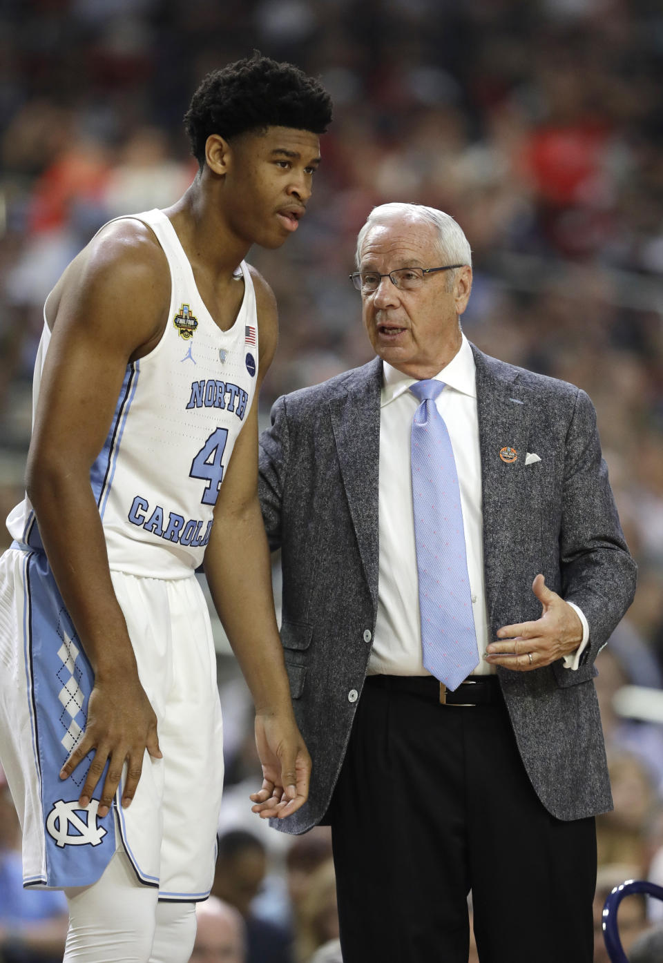 North Carolina head coach Roy Williams talks with forward Isaiah Hicks, left, during the first half against Oregon in the semifinals of the Final Four NCAA college basketball tournament, Saturday, April 1, 2017, in Glendale, Ariz. (AP Photo/David J. Phillip)