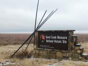 In this Dec. 27, 2019, photo, an entrance sign is shown at the Sand Creek Massacre National Historic Site in Eads, Colo. This quiet piece of land tucked away in rural southeastern Colorado seeks to honor the 230 peaceful Cheyenne and Arapaho tribe members who were slaughtered by the U.S. Army in 1864. It was one of worst mass murders in U.S. history. (AP Photo/Russell Contreras)