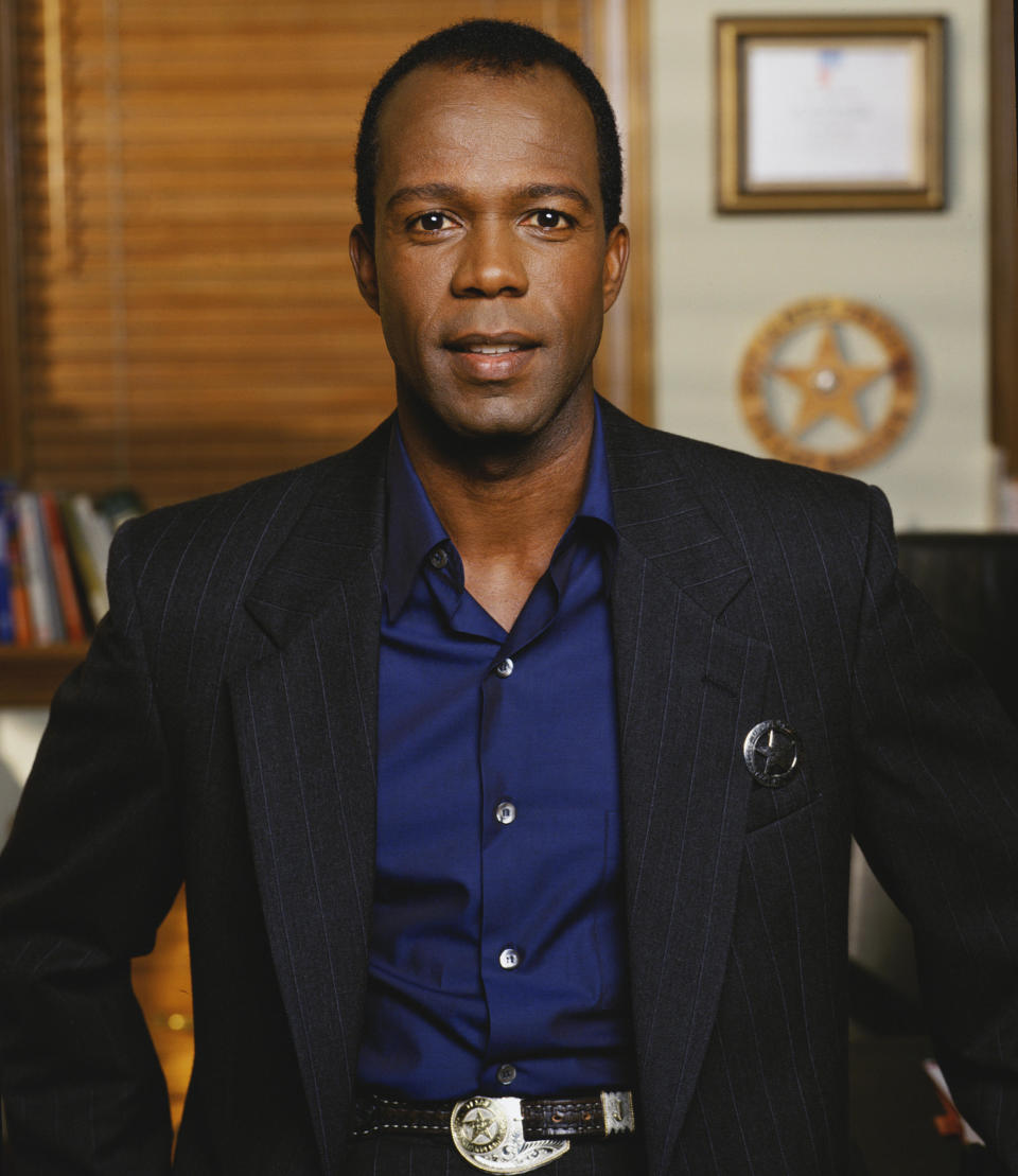 Promotional portrait of American actor Clarence Gilyard Jr (as James 'Jimmy' Trivette), dressed in a pin-stripe suit, for the television series 'Walker, Texas Ranger,' . / Credit: CBS Photo Archive / Getty Images