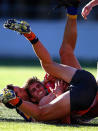 Aidan Corr of the Giants of the Giants is tackled during the round nine AFL match between the Greater Western Sydney Giants and the West Coast Eagles at Skoda Stadium on May 25, 2013 in Sydney, Australia.