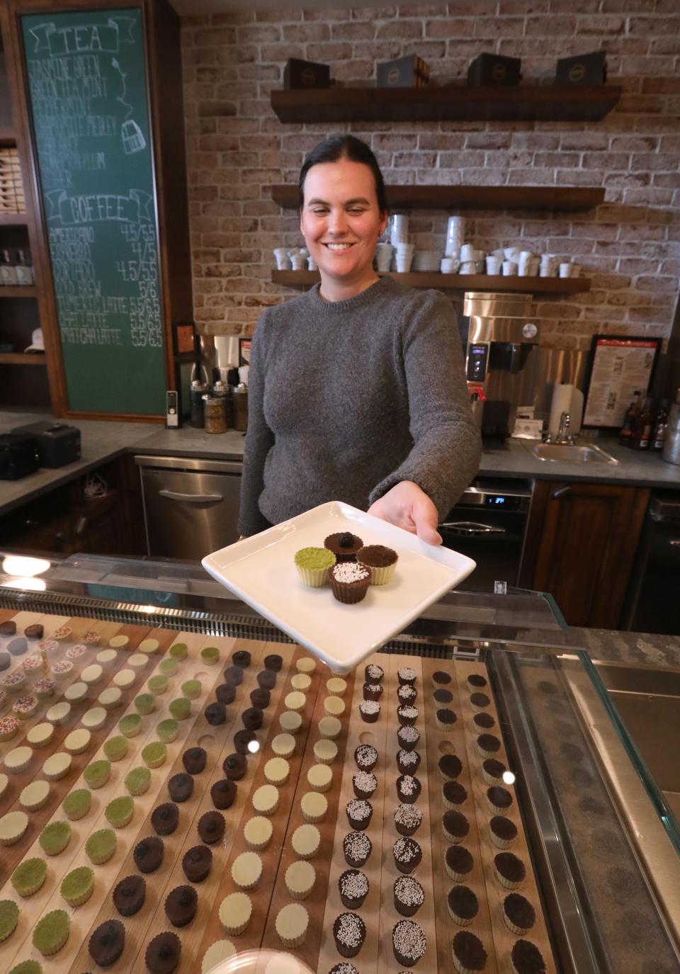 Charlotte Denoyer with chocolates at Cafe Deux in Harrison March 17, 2023. The restaurant is participating in "Taste of Harrison" May 7.