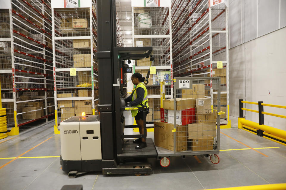 TAMPA, FLORIDA - NOVEMBER 27: Amazon associates work to ship out same day orders during Cyber Monday at the Same-Day Delivery Facility Fulfillment Center on November 27, 2023 in Tampa, Florida. Dedicated to online shopping, Cyber Monday is one of Amazon's busiest days following Thanksgiving, marked by retailers providing substantial discounts and promotions. (Photo by Octavio Jones/Getty Images)