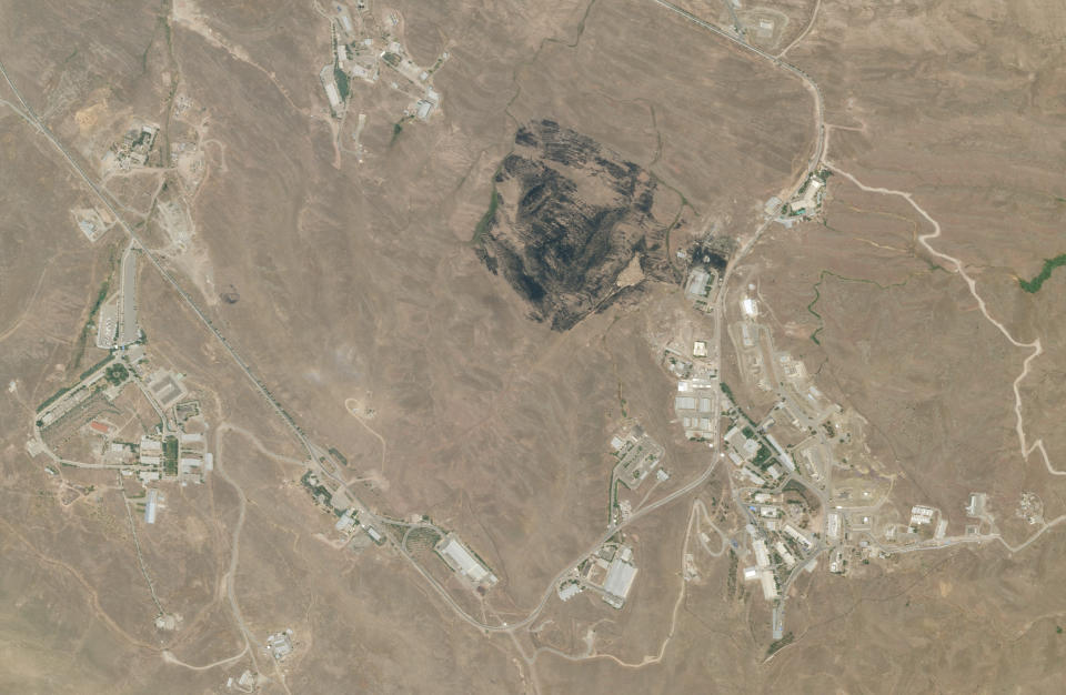 This Saturday, June 27, 2020, satellite image from Planet Labs shows the site of an explosion that rattled Iran's capital. Analysts say the blast Friday, June 26, 2020 came from an area in Tehran's eastern mountains they hides a underground tunnel system and missile production sites. The explosion appears to have charred hundreds of meters of scrubland. (Planet Labs via AP)