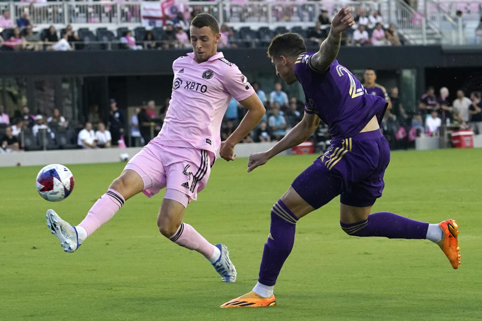 Orlando City forward Gastón González (22) attempts a shot on goal past Inter Miami defender Christopher McVey (4) during the first half of an MLS soccer match, Saturday, May 20, 2023, in Fort Lauderdale, Fla. (AP Photo/Lynne Sladky)