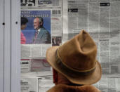 A man reads morning papers in Chisinau, Moldova, October 31, 2016. REUTERS/Gleb Garanich