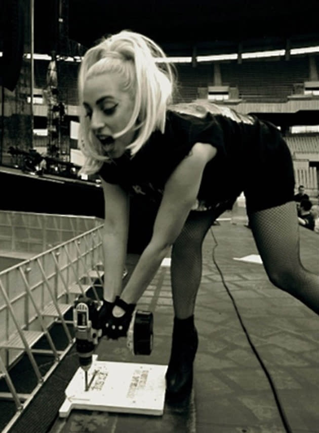 Celebrity photos: Lady Gaga showed off her dedication to her ‘Monsters,’ by helping to build the stage for her world tour. She tweeted: “I will do anything for my fans! Having fun with the stage crew guys, screwing on the runway. A Real Iron Maiden!” [sic]