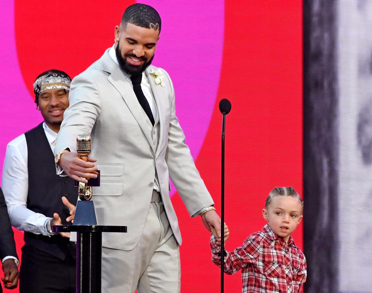 Drake, winner of the Artist of the Decade Award, and Adonis Graham speak onstage for the 2021 Billboard Music Awards, broadcast on May 23, 2021 at Microsoft Theater in Los Angeles, California