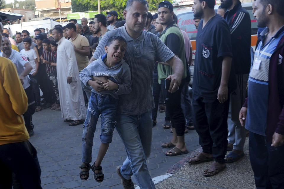 Palestinians wounded in the Israeli bombardment of the Gaza Strip are brought to a treatment room of al Aqsa Hospital on Deir al Balah, Gaza Strip, Friday, Nov. 10, 2023. (AP Photo/Adel Hana)