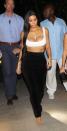 <p>In a white bra top, high-waisted pants, nude sandals, and a gold necklace while heading to a family dinner in Costa Rica.</p>