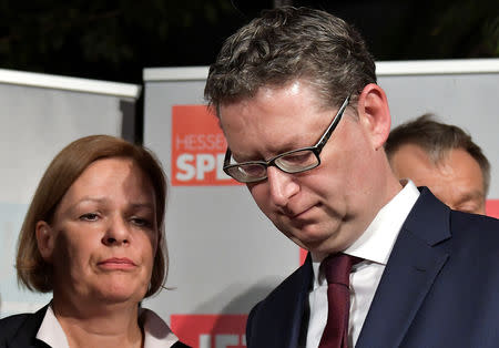 Social Democratic Party (SPD) top candidate Thorsten Schaefer-Guembel and Nancy Faeser, General Secretary of SPD Hessen, react after first exit polls following the Hesse state election in Wiesbaden, Germany, October 28, 2018. REUTERS/Thorsten Wagner TPX IMAGES OF THE DAY