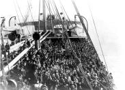 <p>Immigrants pack the upper deck of the liner SS Patricia as it travels from Hamburg, Germany, to New York, Dec. 10, 1906. (Photo: Edwin Levick/FPG/Getty Images) </p>