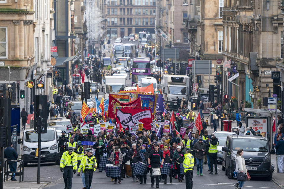 People take part in the annual Scottish Trades Union Congress (STUC) St Andrew's Day march and rally in Glasgow, in solidarity with those impacted by racism and racial discrimination throughout Scotland, in Glasgow, Scotland, Saturday, Nov. 25, 2023. (Jane Barlow/PA via AP)