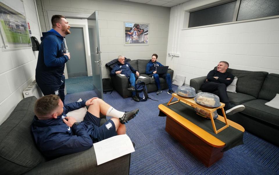 Assigned Preston manager Ryan Lowe, right, and his staff share a laugh in the manager's office - Jon Super