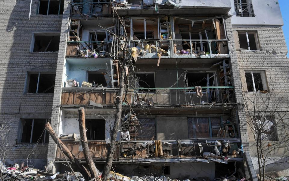 A multifamily residential building destroyed during shelling in Kharkiv, Ukraine - Shutterstock