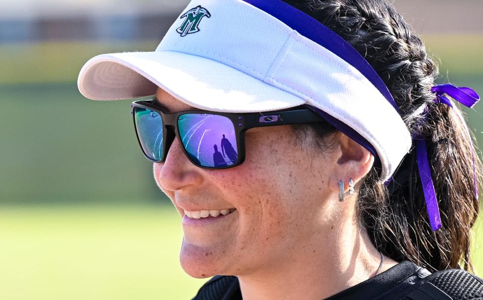 El Diamante coach Stephanie Rapozo watches team play against Redwood in an East Yosemite League high school softball Thursday, April 25, 2024. El Diamante and Redwood hosted a “Purple Out Game” to raise awareness/benefit Crohn’s Disease and Ulcerative Colitis.