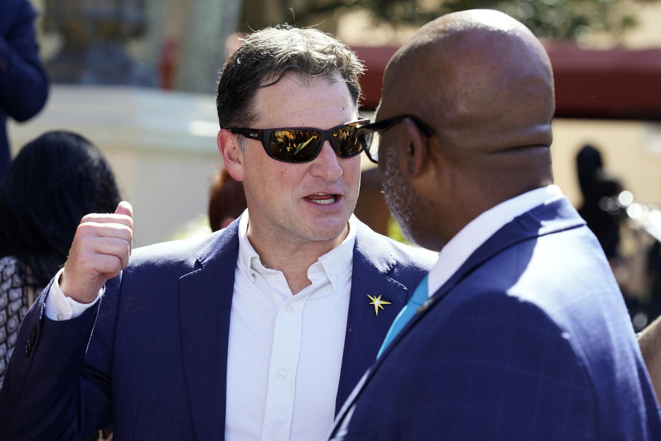 Tampa Bay Rays president Brian Auld, left, talks to St. Petersburg mayor Ken Welch after Welch delivered his State of the City speech Monday, Jan. 30, 2023, in St. Petersburg, Fla. Welch selected the team led by the Tampa Bay Rays to redevelop Tropicana Field. The Rays made their pitch as part of a joint proposal to rebuild Tropicana Field and the 86 acres it occupies with international real estate investment and development group Hines.(AP Photo/Chris O'Meara)