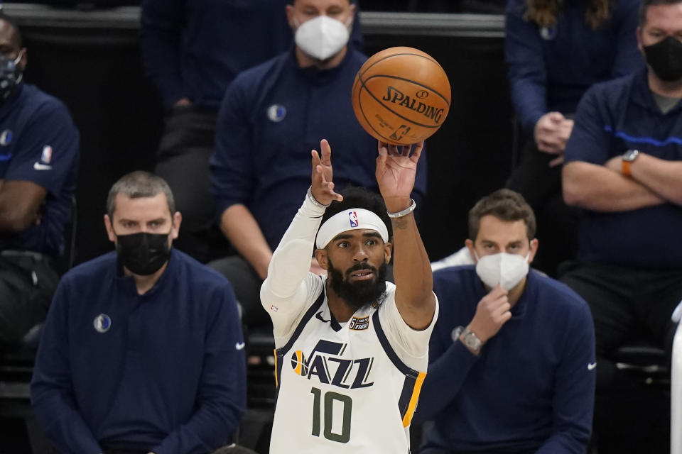 Utah Jazz guard Mike Conley (10) shoots a 3-pointer in the second half during an NBA basketball game against the Dallas Mavericks Wednesday, Jan. 27, 2021, in Salt Lake City. (AP Photo/Rick Bowmer)