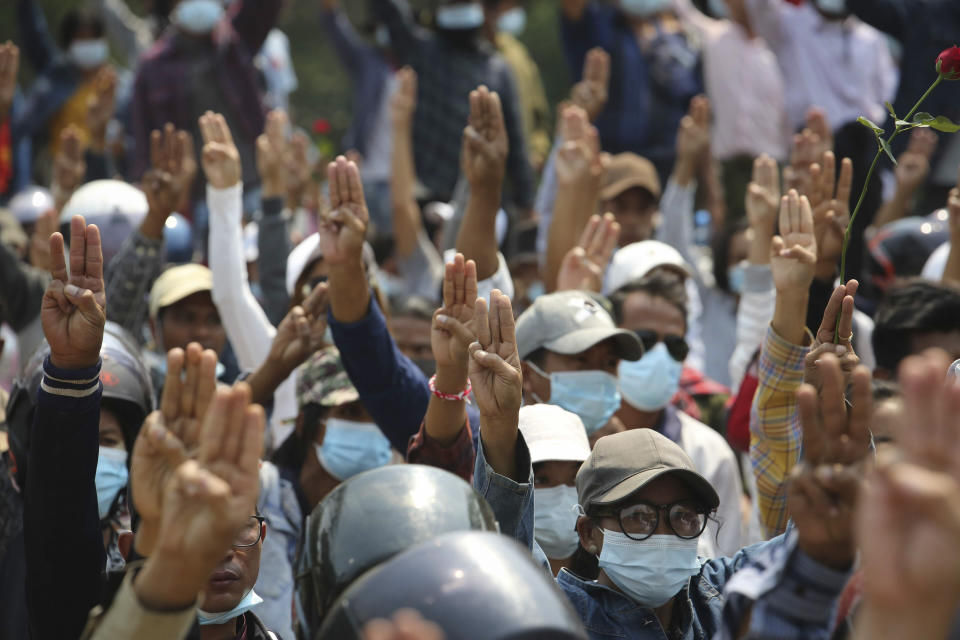 Anti-coup protesters flash a three-fingered sign of resistance during a demonstration in Naypyitaw, Myanmar, Monday, March 8, 2021. The escalation of violence in Myanmar as authorities crack down on protests against the Feb. 1 coup is raising pressure for more sanctions against the junta, even as countries struggle over how to best sway military leaders inured to global condemnation. (AP Photo)