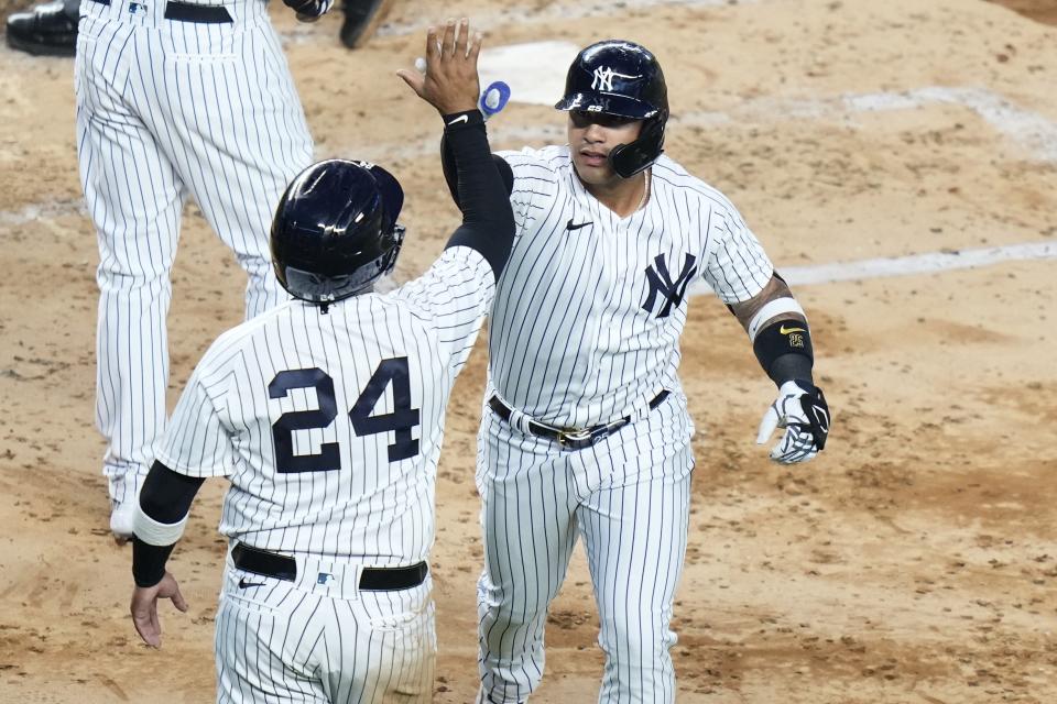 New York Yankees' Gleyber Torres, right, celebrates with teammate Willie Calhoun after they scored on his two-run home run during the fourth inning in the second baseball game of a doubleheader against the Chicago White Sox, Thursday, June 8, 2023, in New York. (AP Photo/Frank Franklin II)