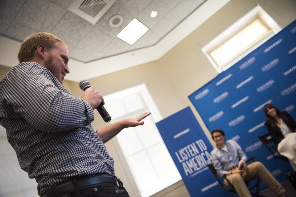 Audience member Lee Hales asks questions of panelists Eric Baker, Ashley Lee and Carley Porter (not shown).