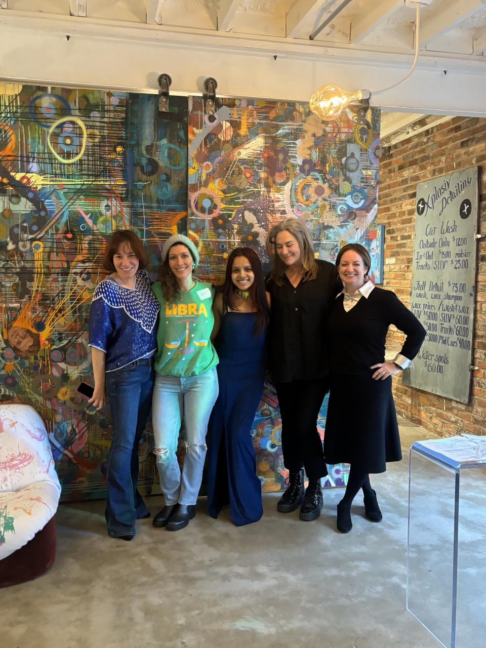 Carolina Braunschweig on the far left organized the Race to the Prom dress giveaway, and Beth Vantosh (second from right) donated her space for the pop-up shop, which was staffed by a dedicated troop of volunteers.