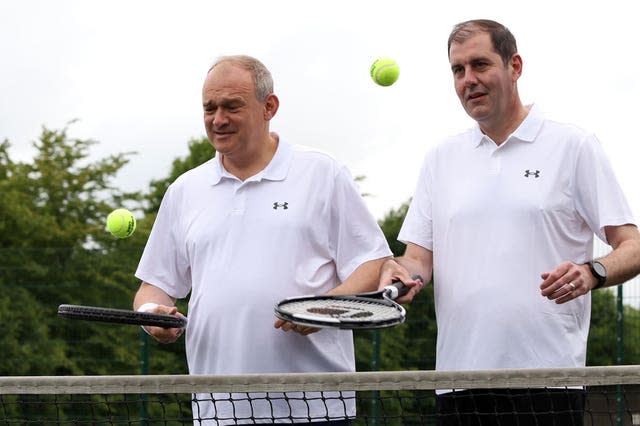 Sir Ed Davey and Lee Dillon show off their racquet skills, bouncing balls in Newbury