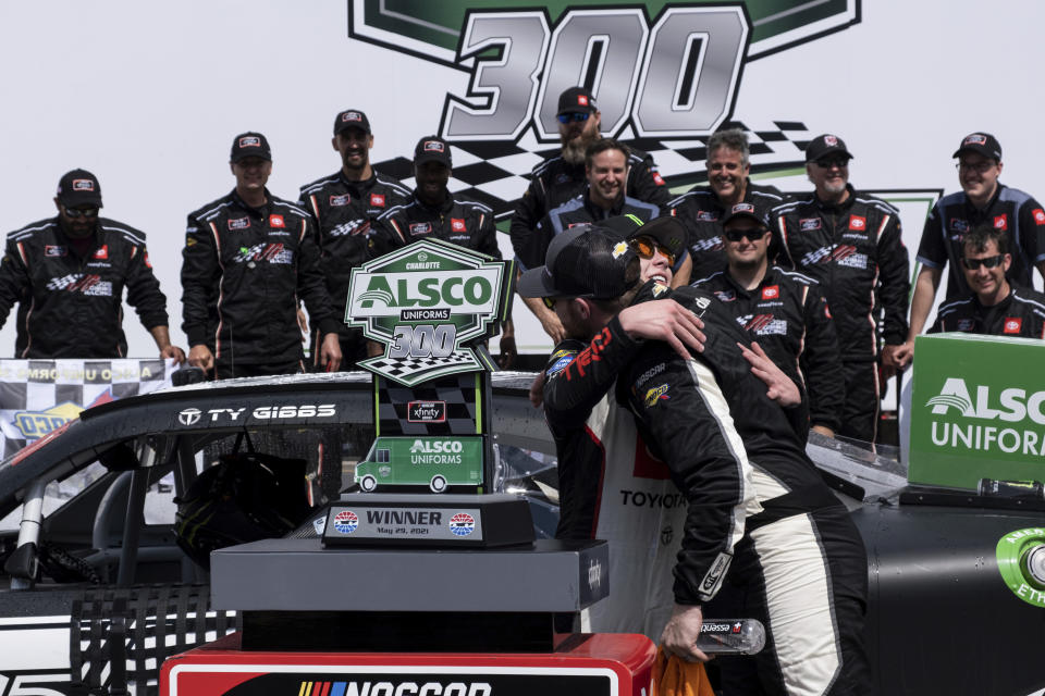 Ty Gibbs, left, gets a hug from fellow driver Ty Dillon after winning the Alsco Uniforms 300 NASCAR Xfinity Series auto race at Charlotte Motor Speedway on Saturday, May 29, 2021 in Charlotte, NC. (AP Photo/Ben Gray)