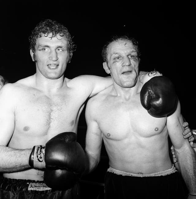 Joe Bugner, left, edged out Henry Cooper (PA)